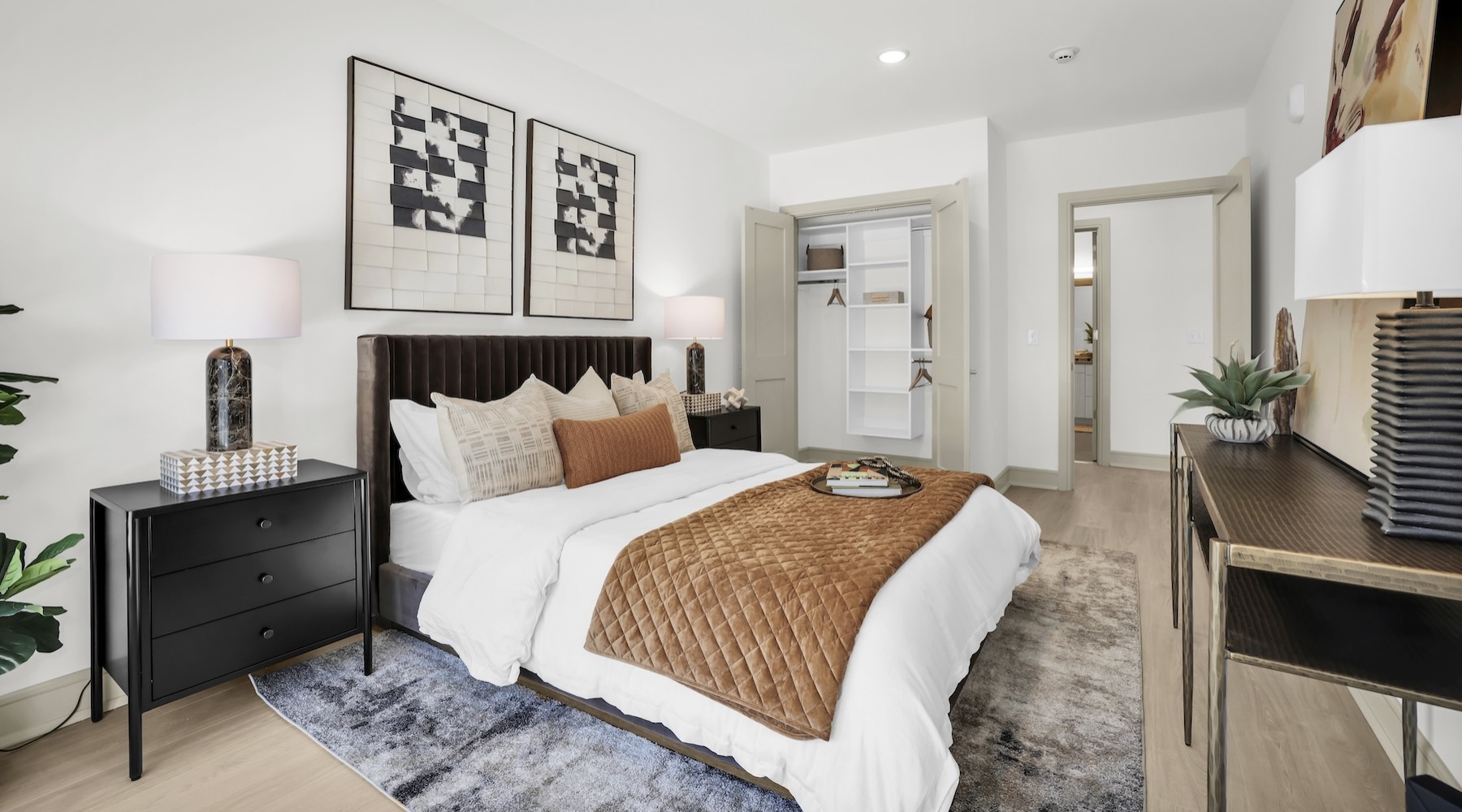 a bedroom with a bed and two nightstands