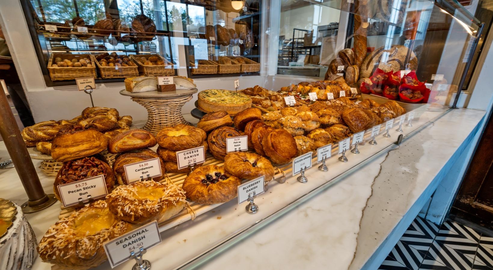 a display case with various pastries