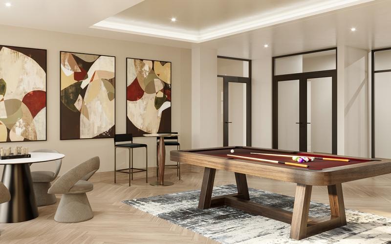 a clubroom with a pool table, table and chairs